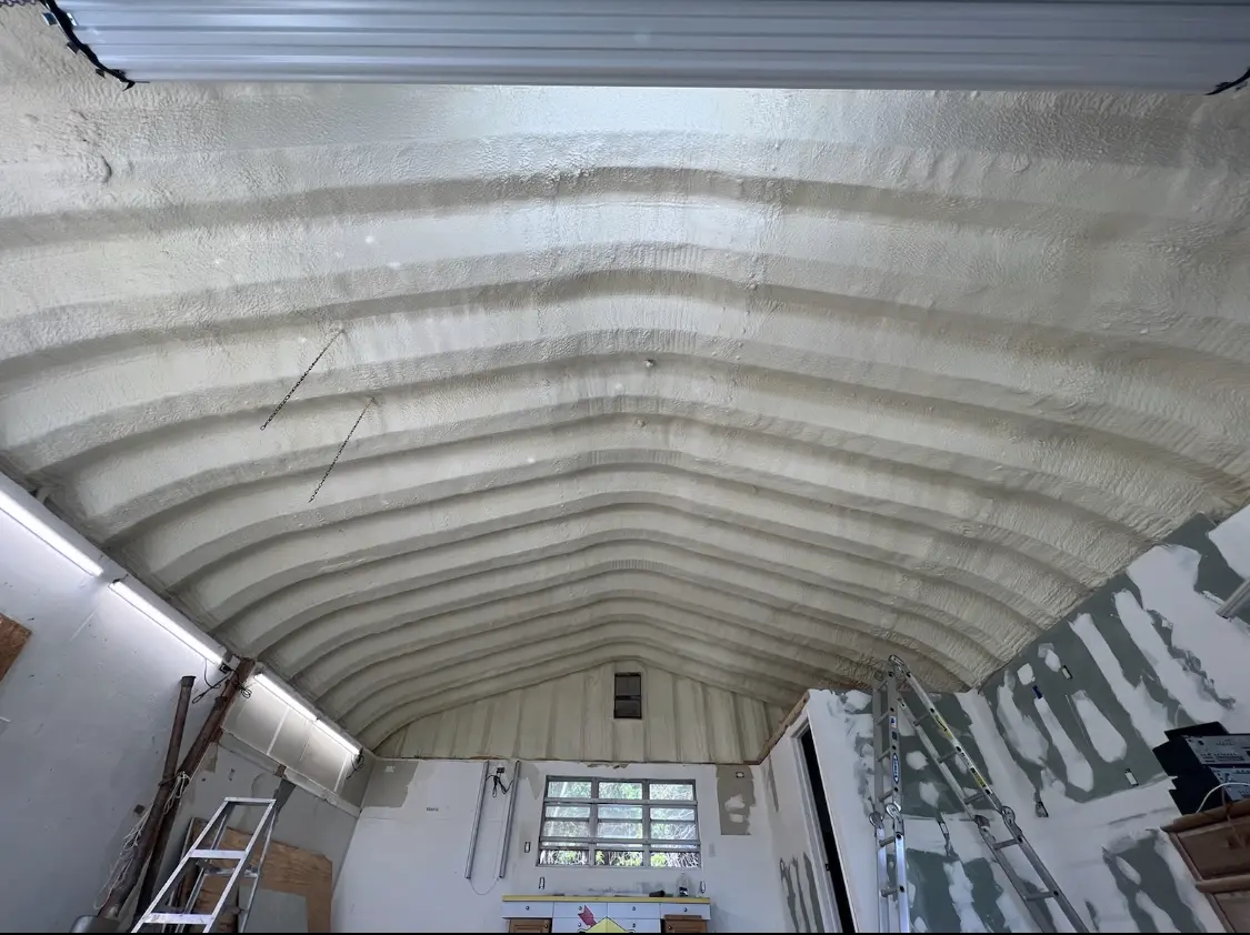 Spray polyurethane foam applied to the underside of a metal roof deck in Spring Ridge